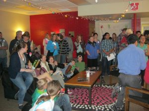 Crowd gathered in Our CASA room for opening party