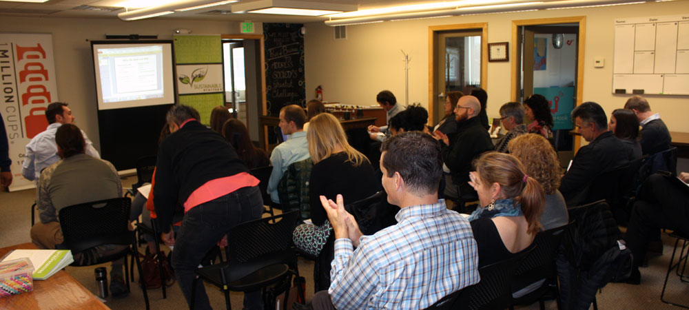 Audience clapping after watching a pitch from Startup Incubator participant