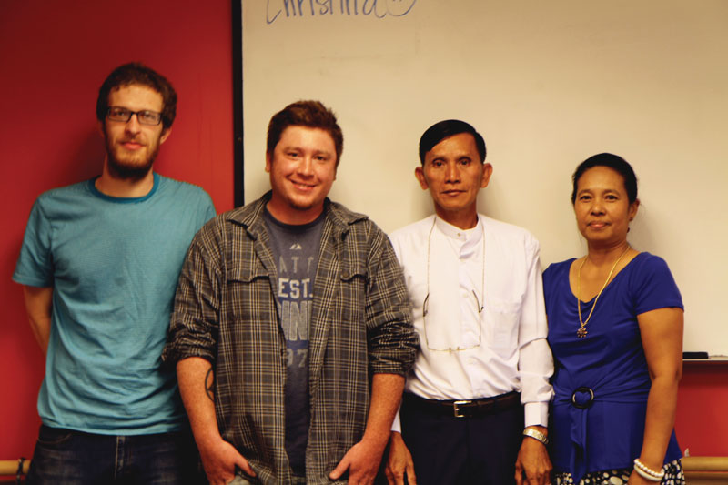 Two grads and two teachers of citizenship class